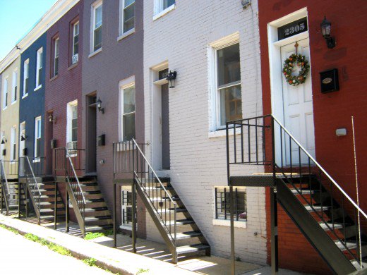 These simple homes are on a very narrow street, once an alley. Double basements